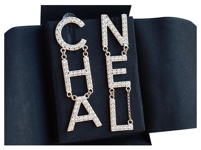 Orecchini con logo Chanel "CHA NEL" Argento D'oro