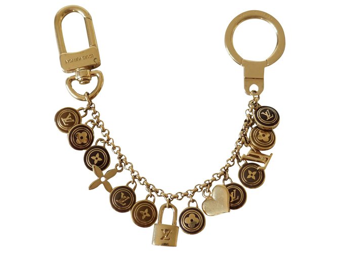 Louis Vuitton Encantos de saco Dourado Metal  ref.225256