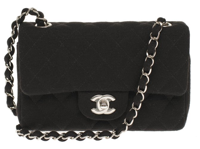 Esplêndida bolsa Chanel Mini Timeless em tweed preto, Garniture en métal argenté, Nova Condição  ref.236374