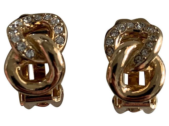 Brincos de encaixe Dior dourados em aço