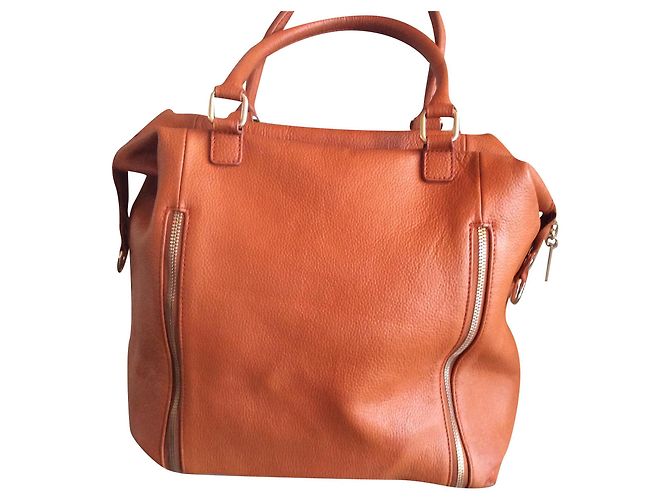 Autre Marque Orangefarbene Handtasche aus genarbtem Leder