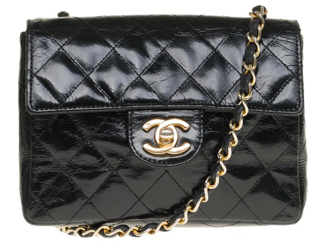 Classique Ravissant sac Chanel Mini Timeless en cuir matelassé noir verni, garniture en métal doré Cuir vernis  ref.242403