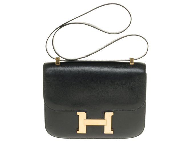 Espléndida Hermès Constance 23 caja de cuero negro, adornos de metal chapado en oro  ref.249683