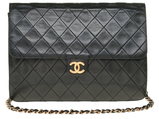 Timeless Chanel Classique Handtasche aus schwarzem gestepptem Lammfell, garniture en métal doré Leder  ref.254871