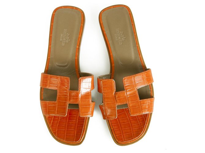 Hermès Hermes Orange Crocodile Leather Oran Sandalias planas Zapatos sin cordones 37,5 Naranja Cueros exoticos  ref.265365