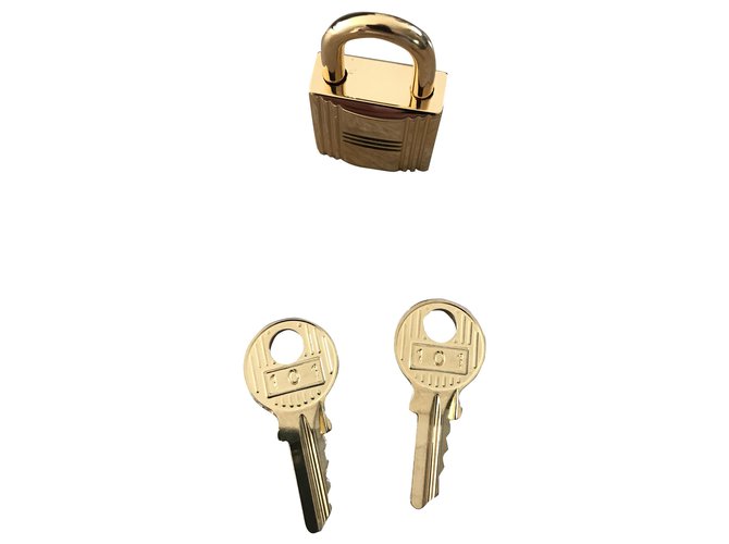 Hermès golden steel padlock with keys Gold hardware  ref.267081