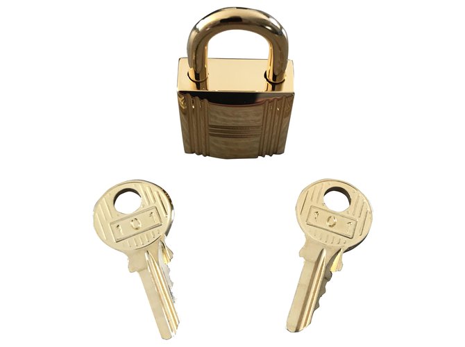 Hermès golden steel padlock for Kelly and Birkin Gold hardware  ref.270314