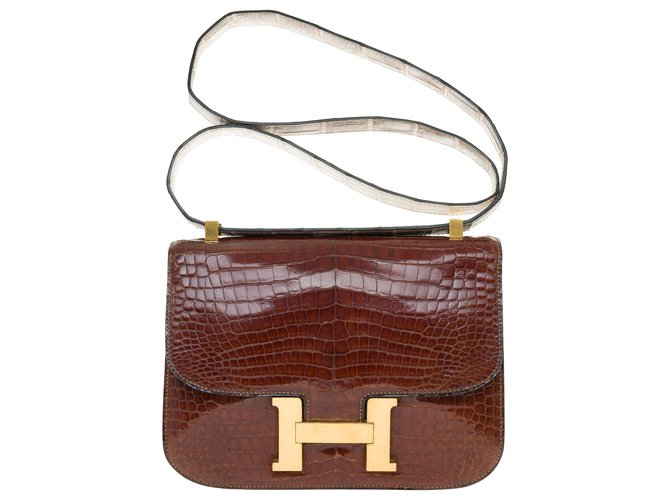 Unique and Splendid Hermès Constance handbag in brown Porosus crocodile leather customized with a crocodile strap Exotic leather  ref.272229