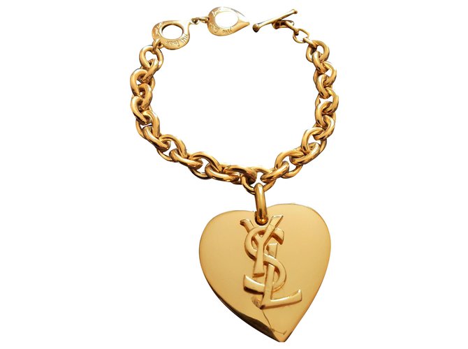 Yves Saint Laurent.  Bracelet pendentif cœur. Plaqué or Bijouterie dorée  ref.274806