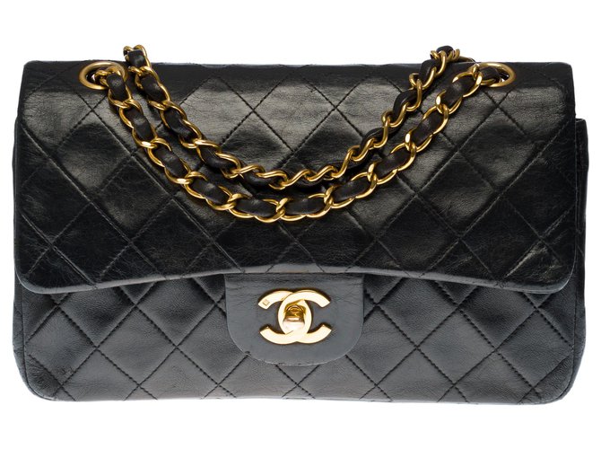 El codiciado bolso Chanel Timeless 23cm de cuero acolchado negro, guarnición en métal doré  ref.277807