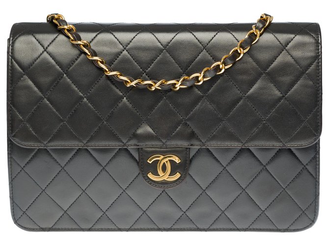 Timeless Herrliche klassische Chanel-Tasche 25cm in schwarzem gestepptem Leder, garniture en métal doré  ref.284275