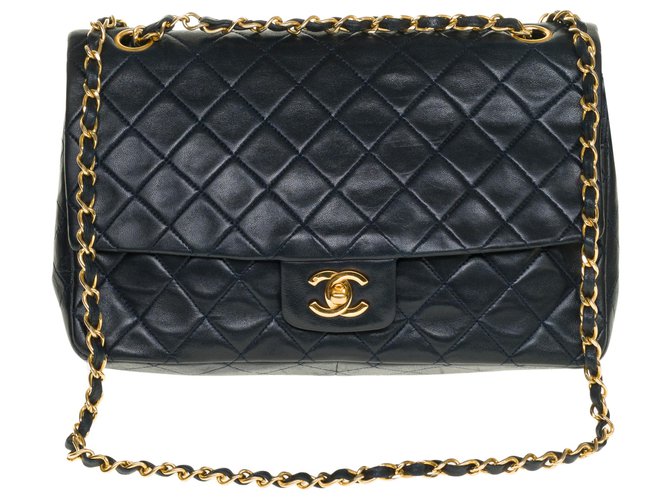 Splendid and Rare Chanel Timeless / Classique in navy blue quilted lambskin with Matching pouch, garniture en métal doré Leather  ref.286700