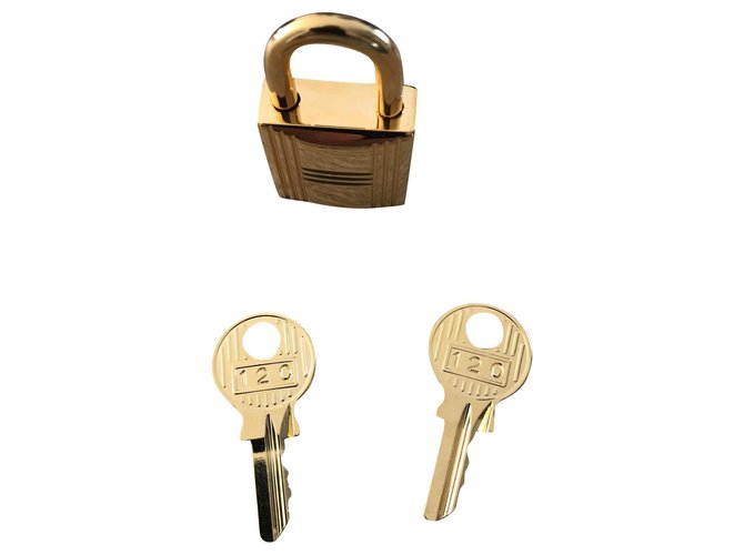 Candado hermès nuevo acero dorado 2 llaves y bolsa para el polvo Gold hardware  ref.296611