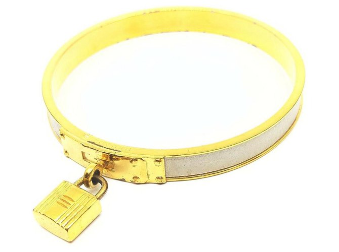 Hermès Gold Kelly Cadena Bangle Bracelet Cuff Leather White gold Metal  ref.298407