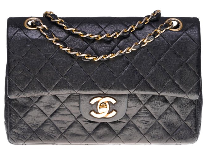 The highly sought after Chanel Timeless bag 23cm with lined flap in black quilted leather, garniture en métal doré  ref.300949