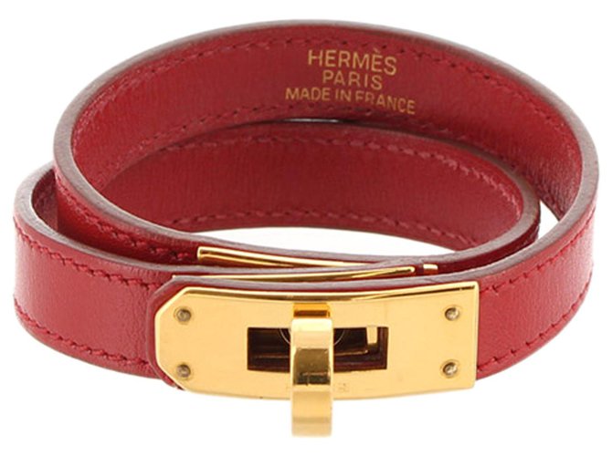 Hermès Bracciale Hermes Rosso Swift Kelly D'oro Pelle Metallo Vitello simile a un vitello  ref.305109