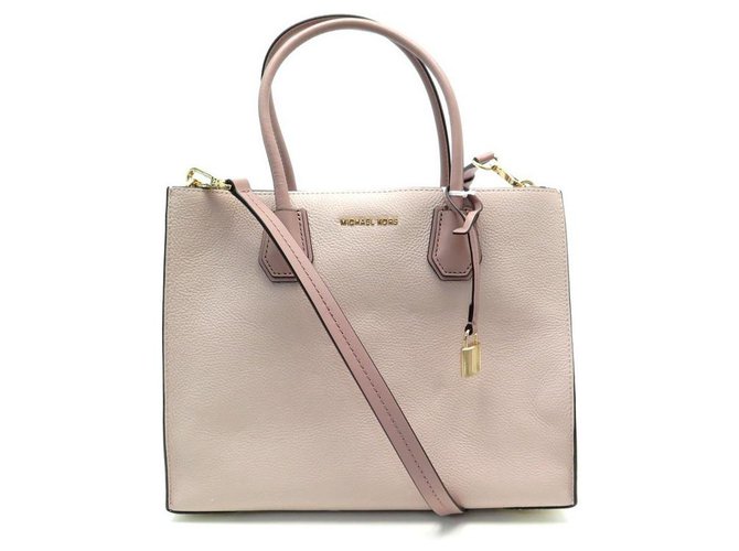 Buy the Michael Kors Pink tote bag with Gold tone Straps