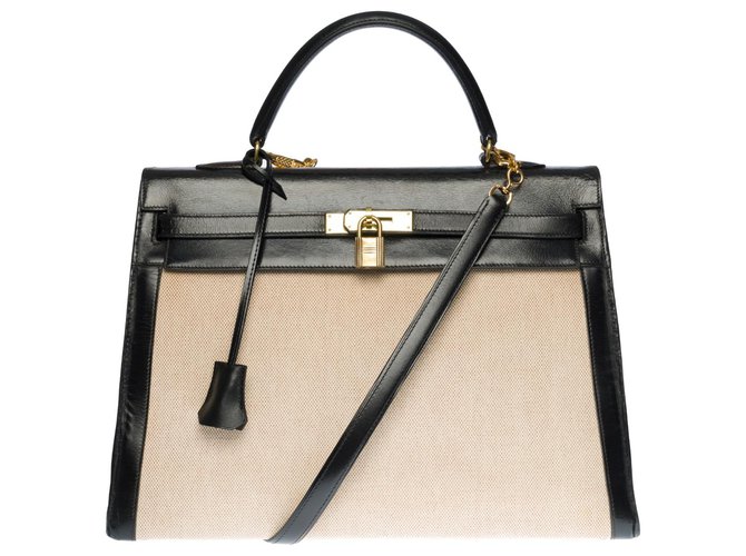 Hermès Impressionante bolsa Hermes Kelly 35 cm em couro caixa preta e lona bege, garniture en métal doré  ref.320223