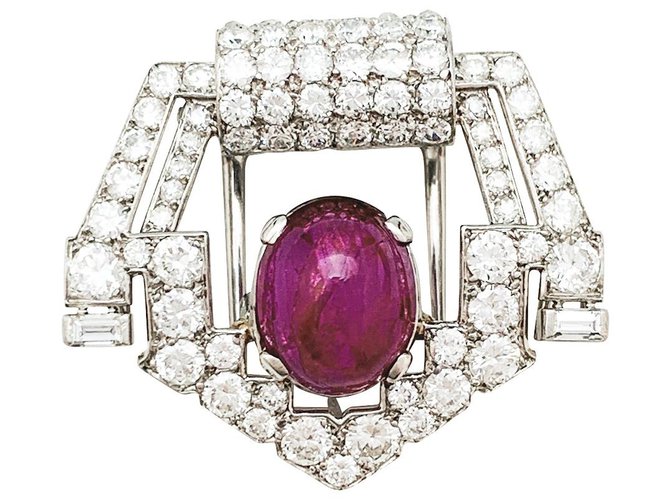 Broche Cartier Art Deco en platino, diamantes y rubí estrella.  ref.325047