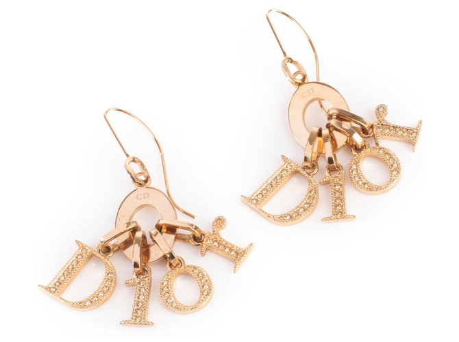 Boucles d'oreilles pendantes Dior dorées à logo en cristal Métal Métallisé  ref.327593