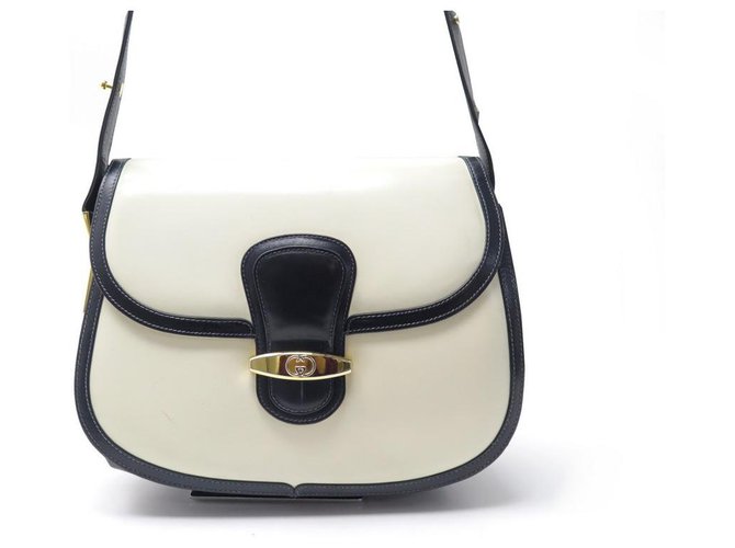 Gucci 1960s Vintage Horsehead Clasp Navy Leather Handbag – Featherstone  Vintage