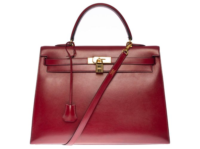Hermès Hermosa bolsa Hermes Kelly 35 cm bandolera de cuero box color burdeos (Rojo h),  adornos de metal chapado en oro  ref.330349