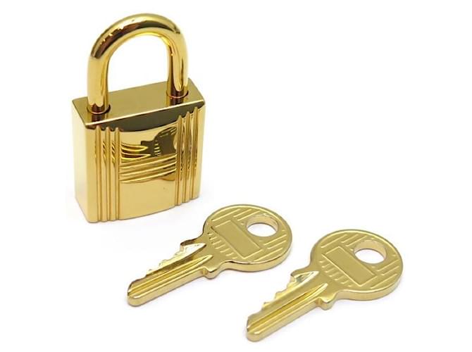 Hermès NOVOS PADLOCKS HERMES + 2 CHAVES PARA A SACOLA KELLY BIRKIN EM GOLD METAL GOLD PADLOCK Dourado  ref.340945