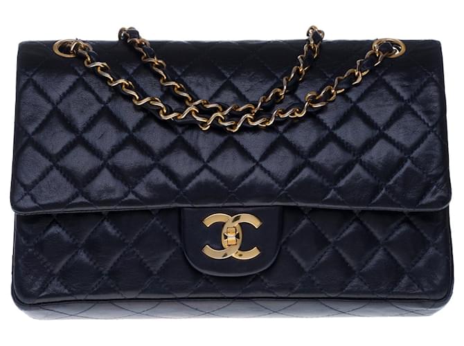 Superb Chanel Timeless Medium handbag 25cm with lined flap in navy blue quilted lambskin, gold metal trim Leather  ref.366640