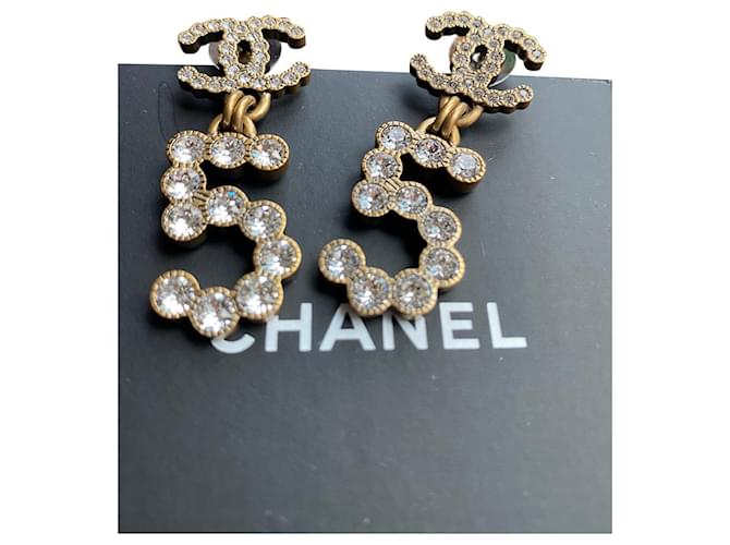 Chanel gold metal and crystals logo dangle earrings new
