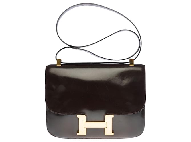 Hermès Splendida borsa Hermes Constance 23 cm in pelle box marrone, garniture en métal doré  ref.386834
