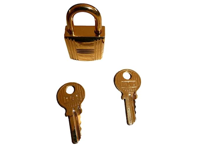 Hermès golden steel padlock for hermès kelly handbag, Gold hardware  ref.402217