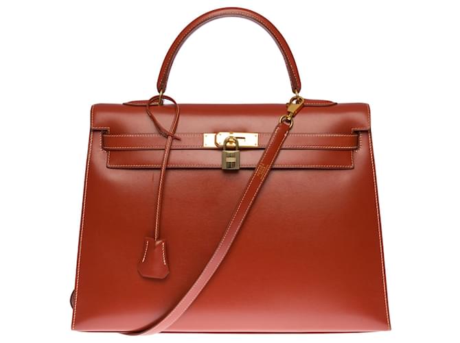 Hermès Excepcional y raro bolso Hermes Kelly 35 correa de sillín de cm en cuero box rojo ladrillo , adornos de metal chapado en oro Roja  ref.402368