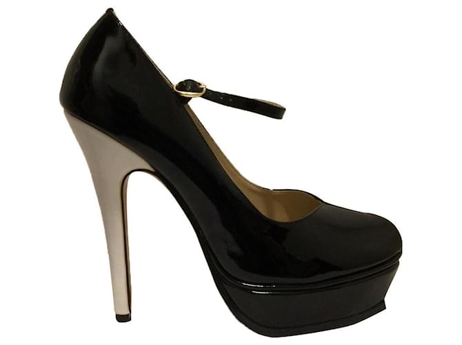 Yves Saint Laurent Tribute Mary Janes in black patent White Patent leather  ref.402532