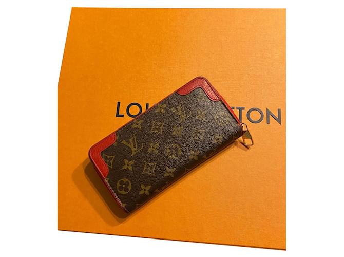 Louis Vuitton Rivoli Geldbörse mit Reißverschluss Braun Rot Leder  ref.403282