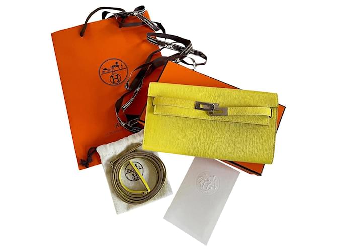 Kelly Hermès Geldbörse zum Mitnehmen Chevre Mysore Gelb Leder  ref.417416