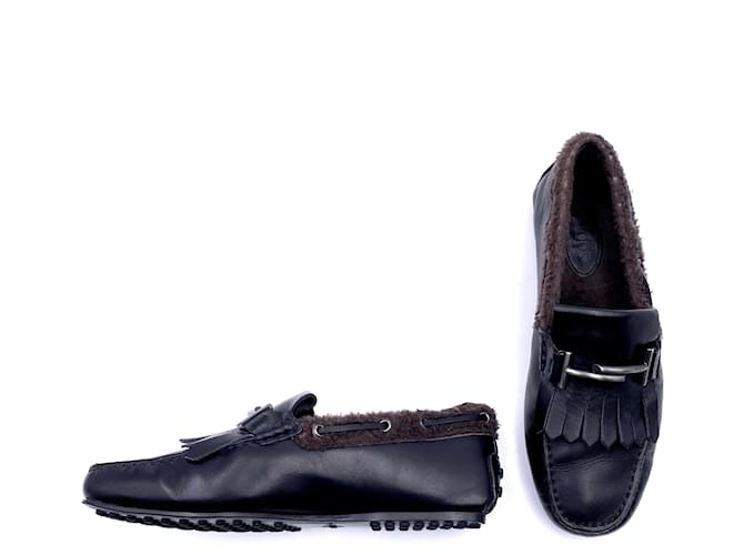 Tod's loafers in black leather and brown shearling  ref.425915