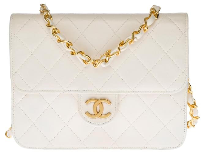 Timeless Splendid Chanel Mini Classique bag in white quilted