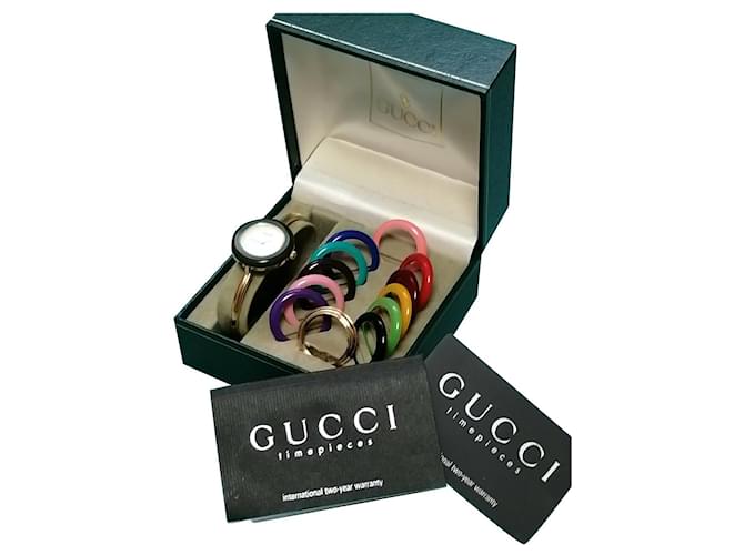 modèle Gucci 11 / 12.2 montre-bracelet à lunette interchangeable, Plaqué or Doré  ref.433966