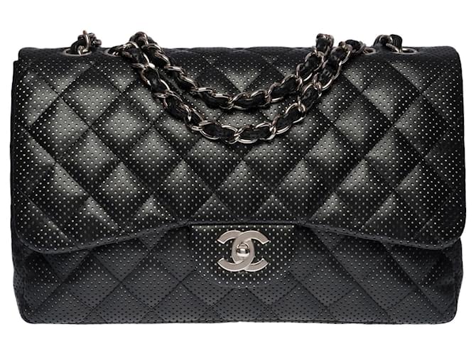 Le Majestueux Chanel Timeless Jumbo Flap bag shoulder bag in black quilted perforated leather, Garniture en métal argenté  ref.474211