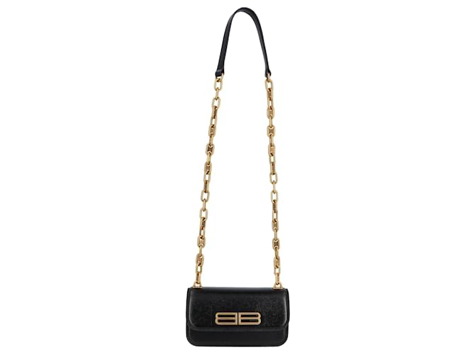 Gaelle black clutch bag with gold shoulder strap