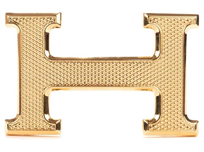 Magnífica hebilla Hermès Constance Guilloche en metal dorado Acero  ref.500258