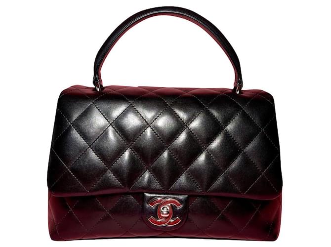 Chanel Bolsa vintage com alça superior em pele de cordeiro. Preto Couro  ref.501558