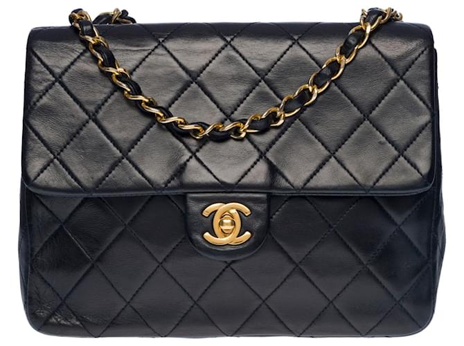 Splendid Chanel Mini Timeless Flap bag in navy blue quilted lambskin, garniture en métal doré Leather  ref.505459