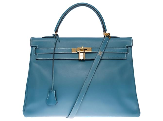 Hermès Impresionante bolso Hermes Kelly 35 correa para el hombro de piel Swift volteada en Blue Jeans con pespuntes blancos , adornos de metal chapado en oro Azul Cuero  ref.510435