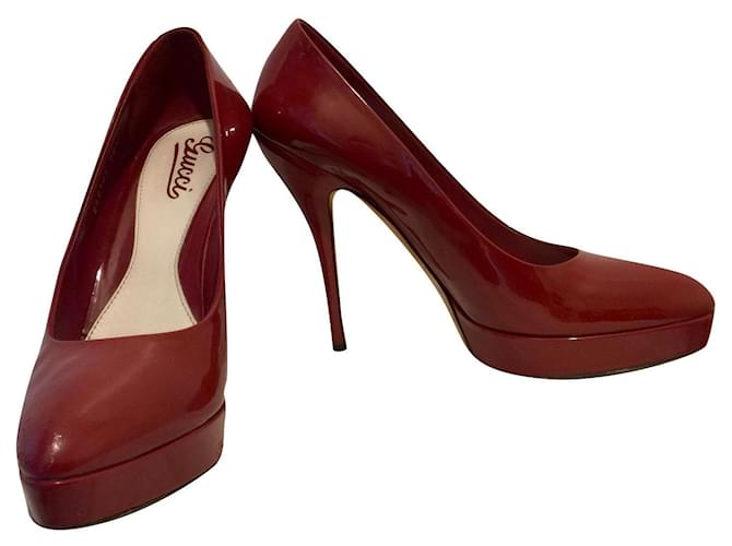 Gucci High heeled patent pumps in dark red with supporting platform Patent leather  ref.513600