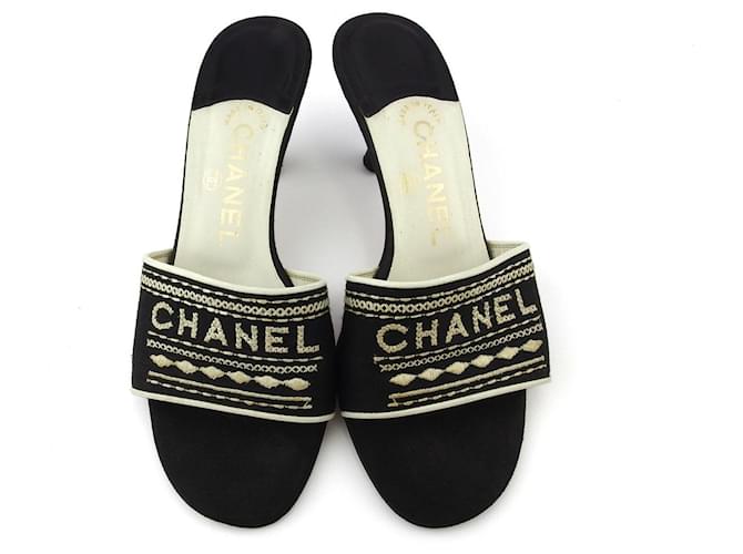 Chanel Mules Black White Leather Cloth  ref.524021