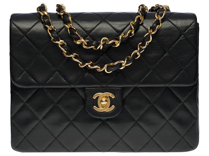 Ravissant Sac à main Chanel Timeless/Classique Mini Flap bag en cuir d’agneau matelassé noir, garniture en métal doré  ref.545544