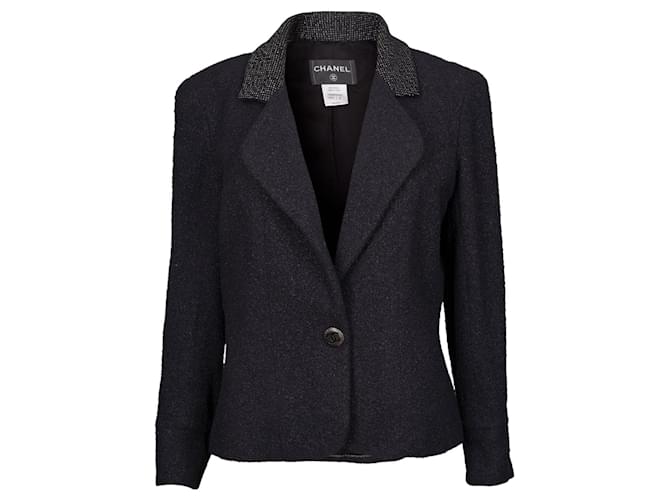 L’iconique veste de tailleur Chanel en tweed noir  ref.566124