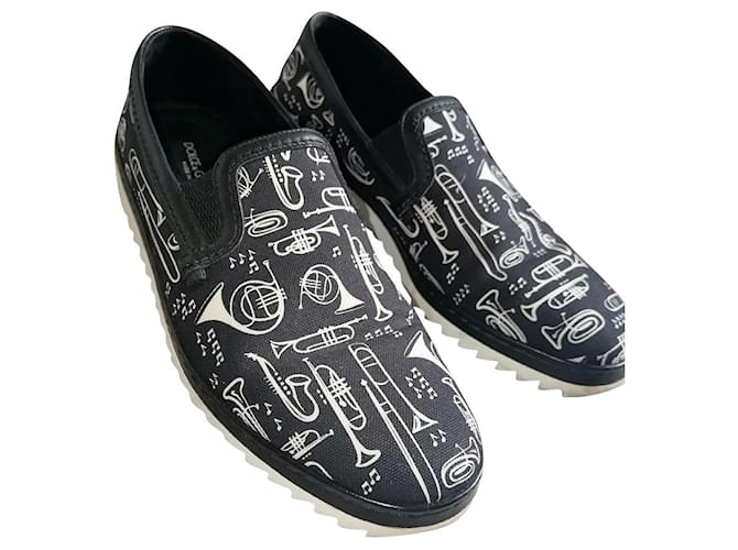 Dolce & Gabbana Slip con estampado de trompeta en zapatillas bajas Negro Lienzo  ref.568927