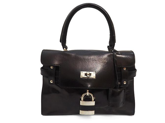 Minibolso negro de charol de Russell & Bromley